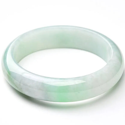 Light green jade stone bracelet showing natural mineral texture on wrist