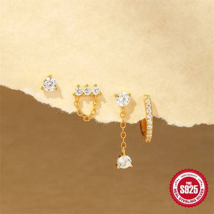 A pair of geometric clover petal earrings in sterling silver with an electroplated gold finish, on a plain background.