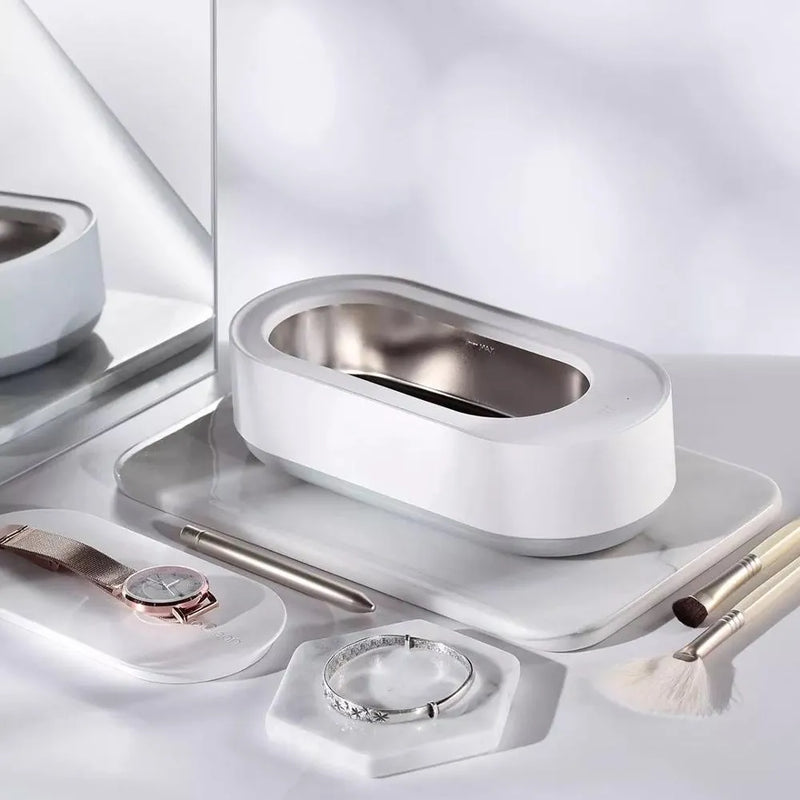 Portable ultrasonic cleaner with 45000Hz high-frequency vibration cleaning machine for jewellery, glasses, watches, and razors featuring a 3-minute cycle, 15W power, and compact ABS stainless steel construction in white colour.