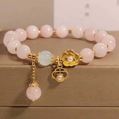 Women's pink crystal flower bracelet with adjustable sizing and refined grace floral design