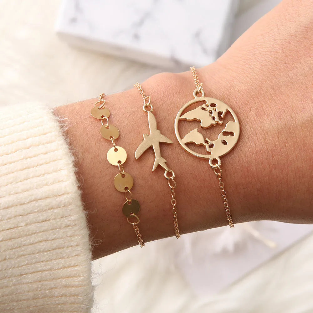 Three alloy charm bracelets with heart-shaped bohemian aircraft map designs, colour Sku2104.