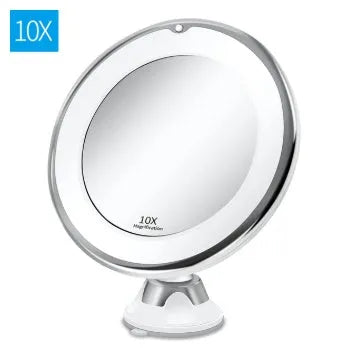 White 10x magnifying LED makeup mirror with flexible gooseneck and suction cup base on a table.