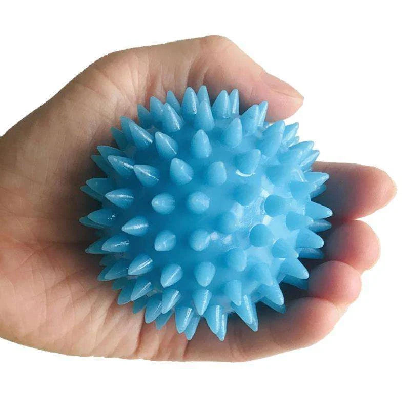 Therapeutic hand grip massager with massage bumps and finger holes for improving grip strength and relaxing hand muscles