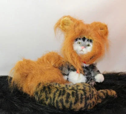 A charming pet hat with a fluffy lion mane and ears, designed to make your furry friend look like the king or queen of the jungle.