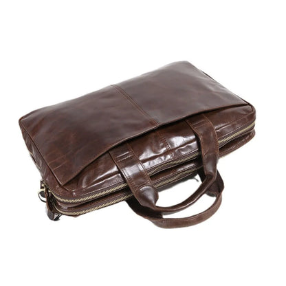 Brown men's leather briefcase with a textured pattern, shown with an open view of the polyester cotton lining.