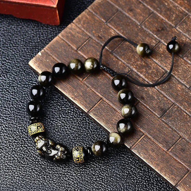 Obsidian Pi Xiu bracelet handmade with natural golden obsidian stones, a traditional Chinese style unisex accessory available in 8mm, 10mm, 12mm or 14mm sizes featuring animal and zodiac modelling.