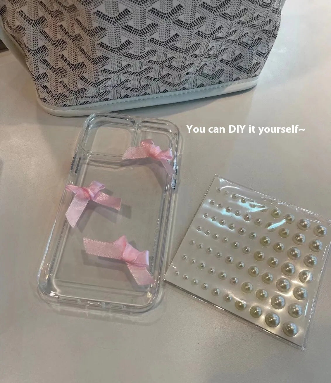 Transparent TPU iPhone case with three-dimensional pearl bow, anti-fall all-inclusive design, colour-matching finish