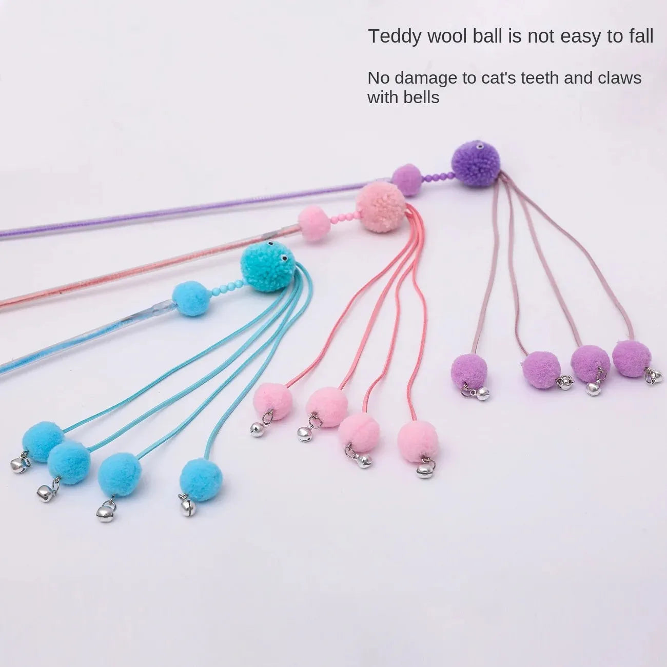 Set of four colourful cat stick toys with dangling tassels, showing blue, pink, and purple handles.