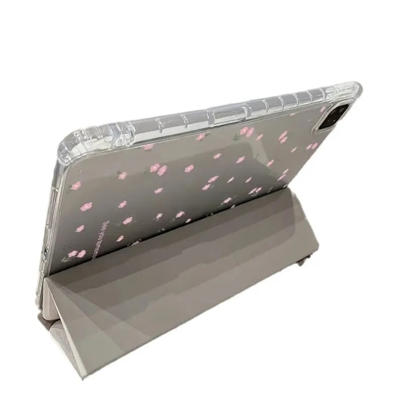 Transparent floral print hard case for iPad with tri-fold magnetic front cover acting as a kickstand.
