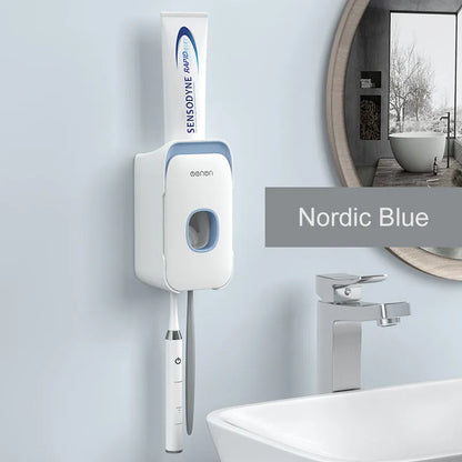 Automatic wall-mounted toothpaste dispenser in blue, grey, and pink colours with LED touch sensor.