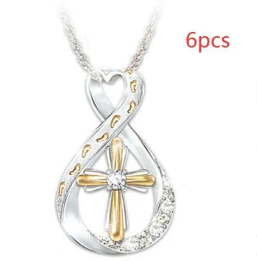 Elegant two-tone cross pendant with sparkling accent, featuring a captivating geometric design and adjustable chain
