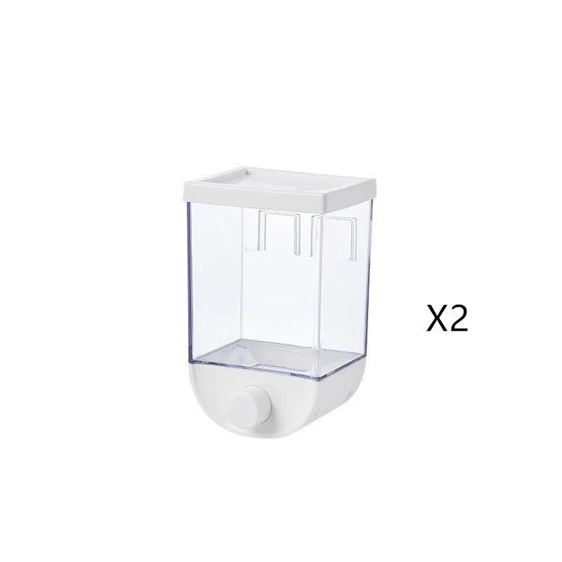 White wall-mountable kitchen food storage box with press lid dispenser, showing transparent body with cereal inside.
