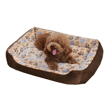 Beige plush pet bed for small dogs with a removable cover and non-slip base, shown in a home setting.