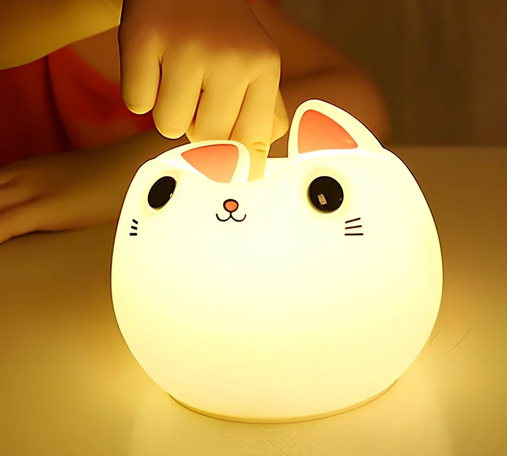 White silicone cat LED lamp with warm glow, measuring 12.5cm tall with USB charging port
