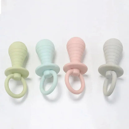 Blue TPR pet pacifier chew toy with squeaker for puppies and kittens on a white background.