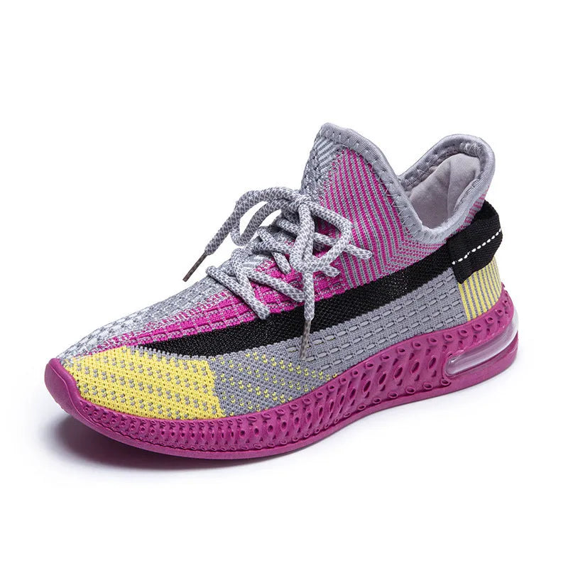Women's casual running shoes in purple, black, and orange colours with fabric lining and plastic sole