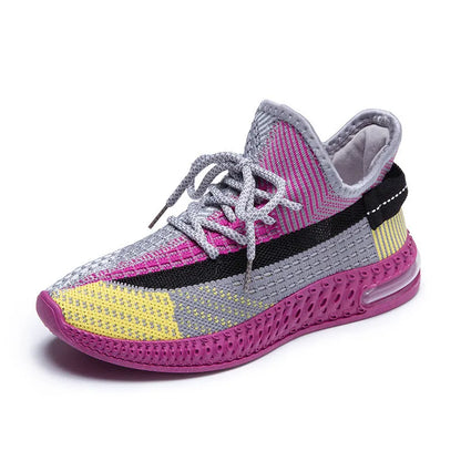 Women's casual running shoes in purple, black, and orange colours with fabric lining and plastic sole
