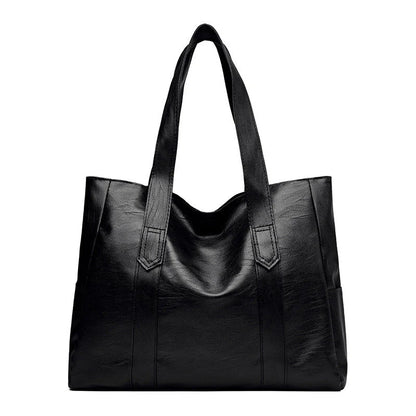 Stylish large capacity commuter shoulder bag in brown and black, perfect for autumn and winter fashion.