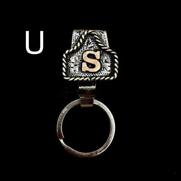 Handmade cow tag design metal keychain on a keyring, shown in one of many available colours.
