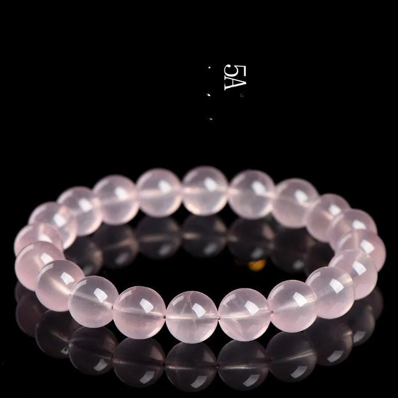 Natural starlight crystal bracelet with polished pink beads in multiple size options