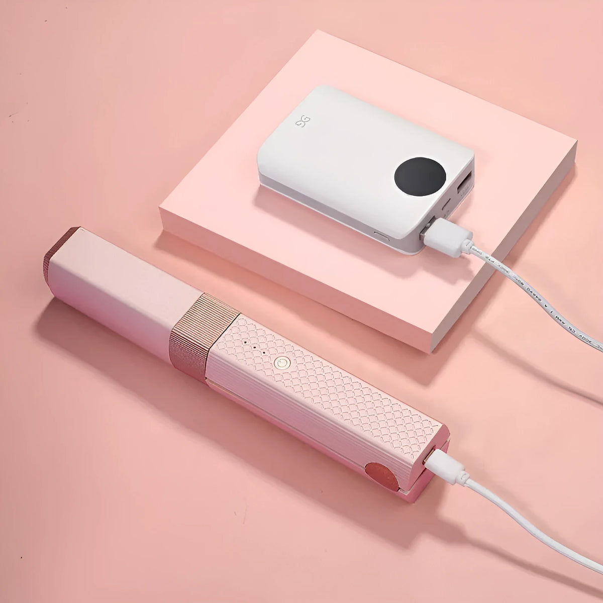 Pink and green portable USB hair straightener and curling iron 3-in-1 tool with compact design.
