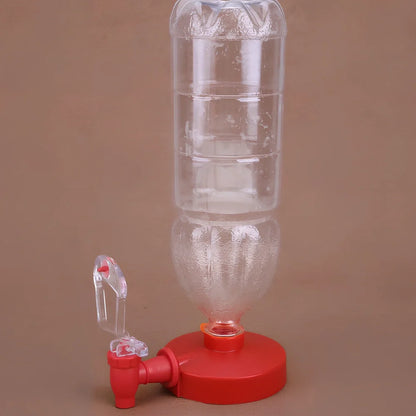 Red automatic soda dispenser gadget attached to beverage bottle for hands-free pouring