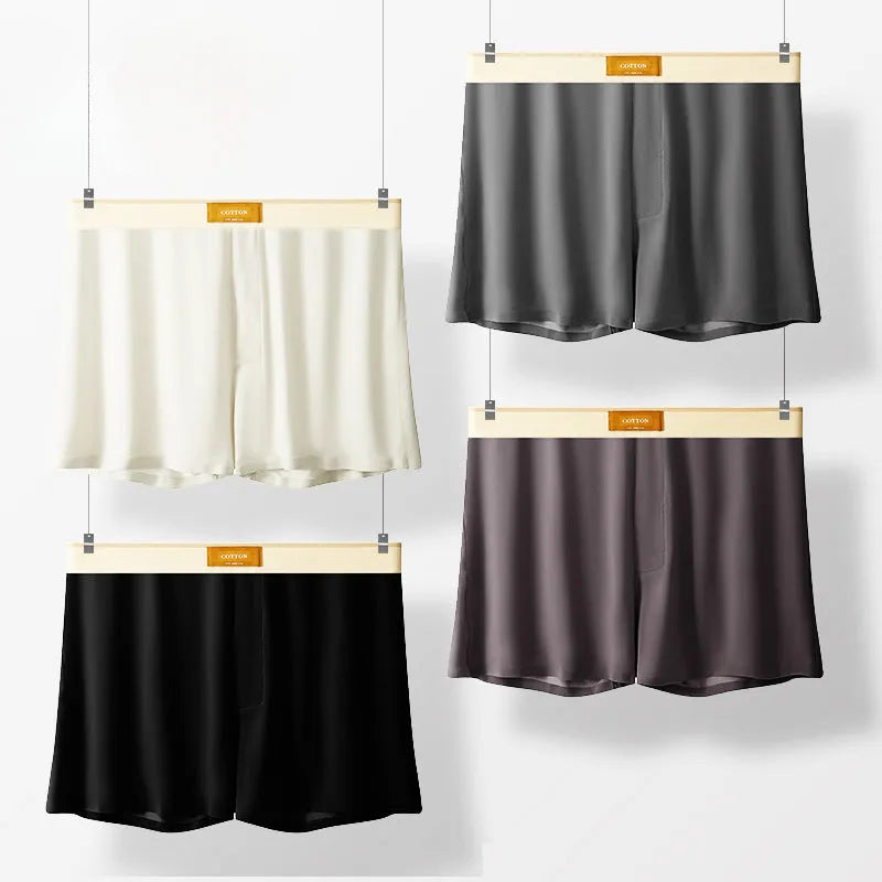 Pack of three pairs of solid colour men's ice silk briefs on a white background