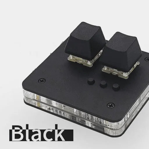Mini USB wired keyboard in white, light grey, black, or pink colour on a desk.