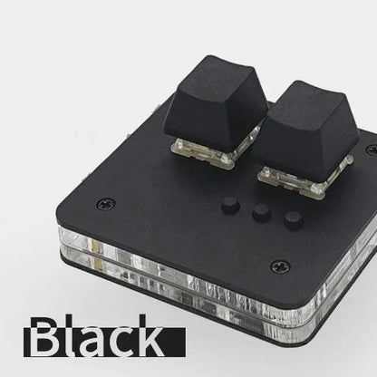 Mini USB wired keyboard in white, light grey, black, or pink colour on a desk.