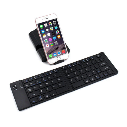 Compact, foldable Bluetooth wireless keyboard with a sleek, minimalist design for use with UK mobile devices