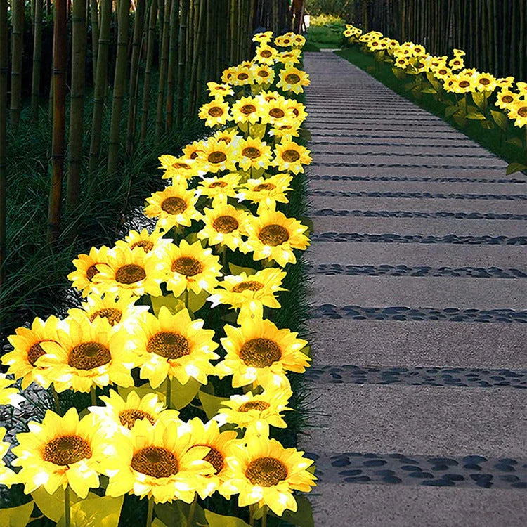 Elegant solar-powered sunflower lamps illuminating a serene outdoor garden pathway