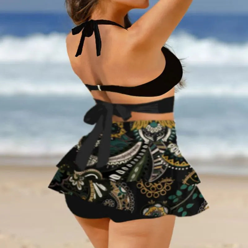 Purple women's bikini and high-waisted skirt swimsuit set with lace-up back detail.