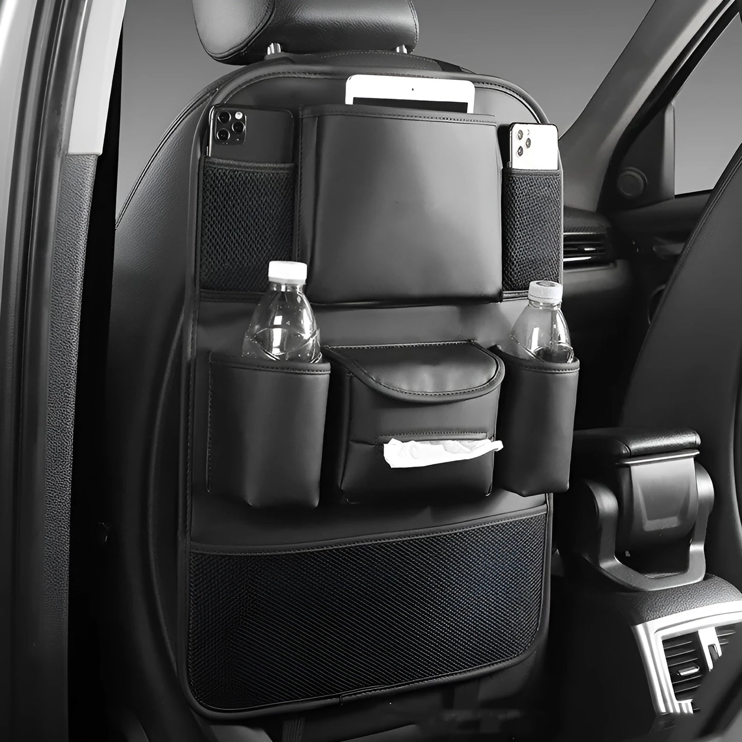 Genuine leather car seat back storage bag hanging from a headrest, shown in brown colour.