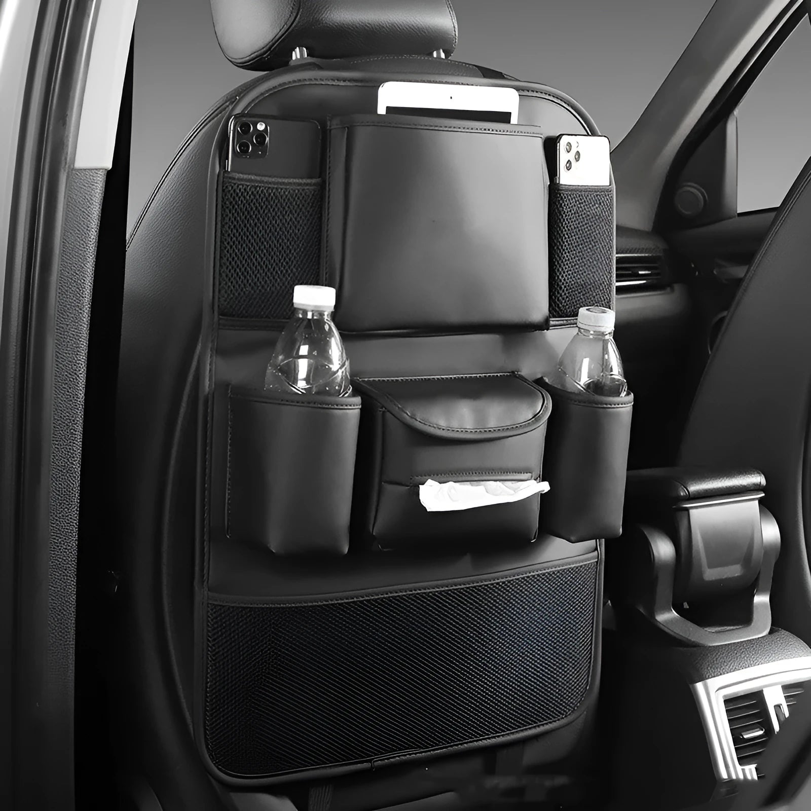 Genuine leather car seat back storage bag hanging from a headrest, shown in brown colour.