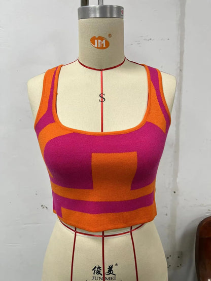 Women's white U-neck slim fit camisole vest with a crop hem, on a mannequin.