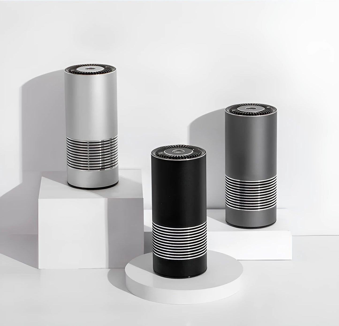 Compact black car air purifier with aluminium alloy and ABS construction, shown next to a car USB port.
