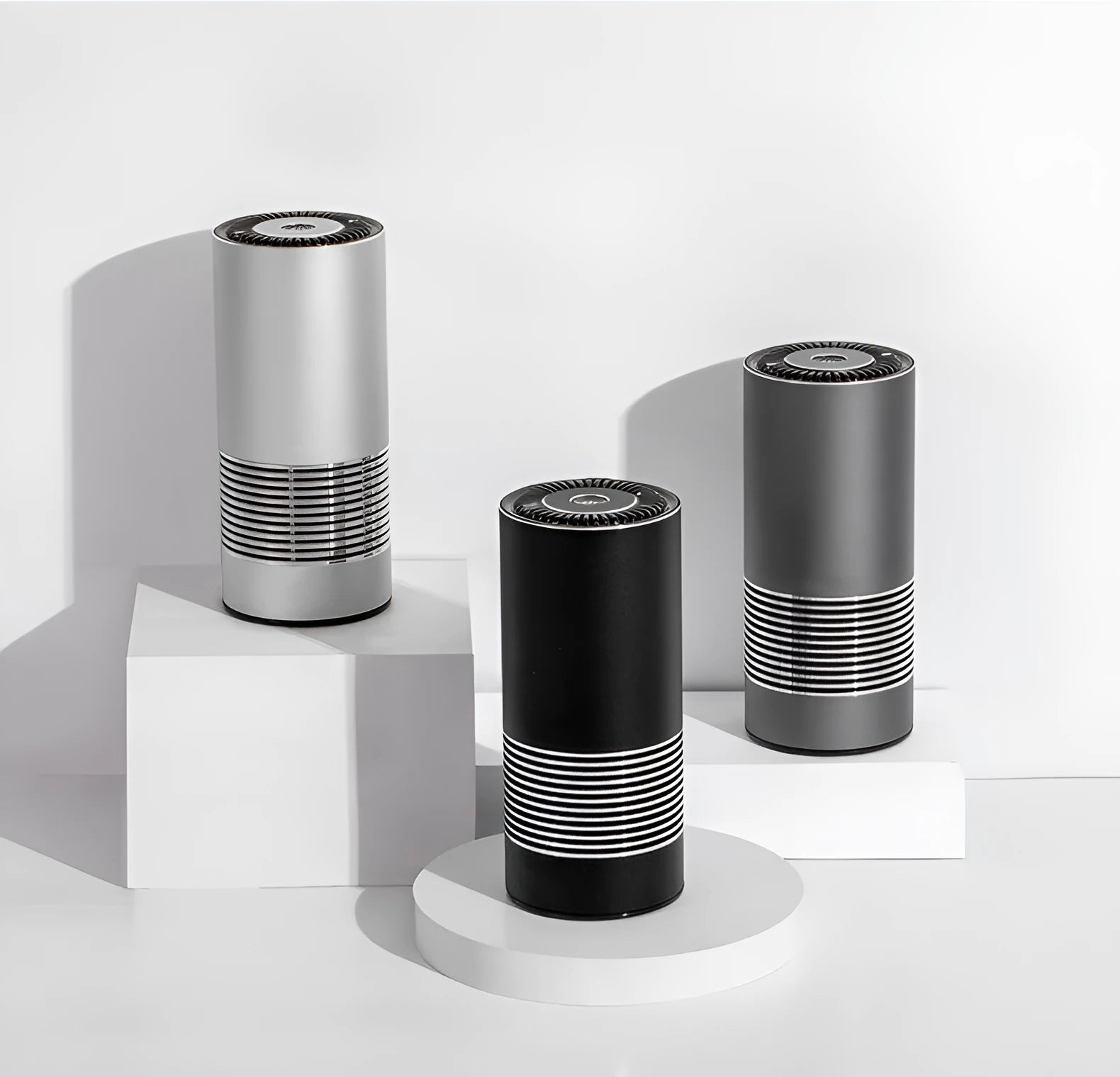 Compact black car air purifier with aluminium alloy and ABS construction, shown next to a car USB port.