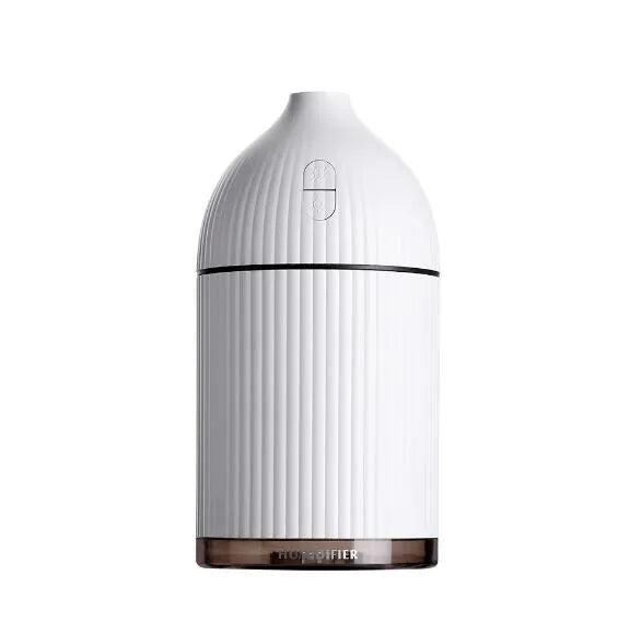 White ultrasonic aromatherapy diffuser and air humidifier with LED light, 300ml capacity, on a desk.