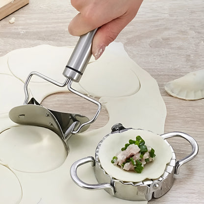 Stainless steel dumpling mould and rectangular dough cutter on a kitchen surface.