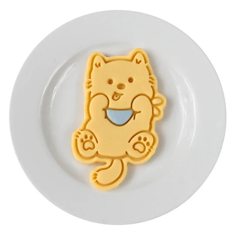 Three-dimensional puppy biscuit mould showing raised details for creating themed baked goods with seven design options