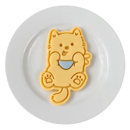 Three-dimensional puppy biscuit mould showing raised details for creating themed baked goods with seven design options