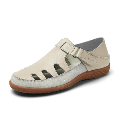 Plus size women's flat sandals with toe cap, hollow design, and thick rubber sole in blue.