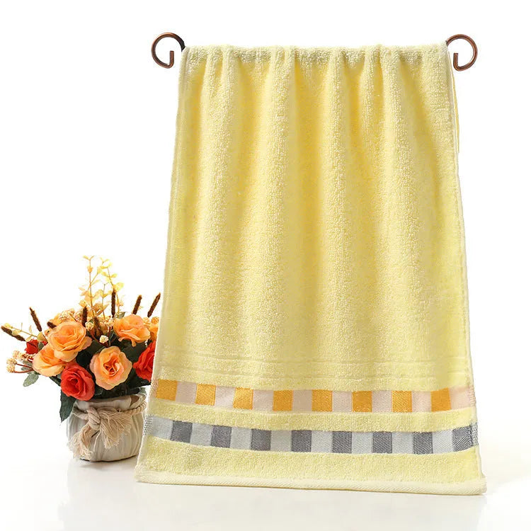 Cotton face towel in blue, pink and yellow colours with heart patterns, dimensions 73x33cm