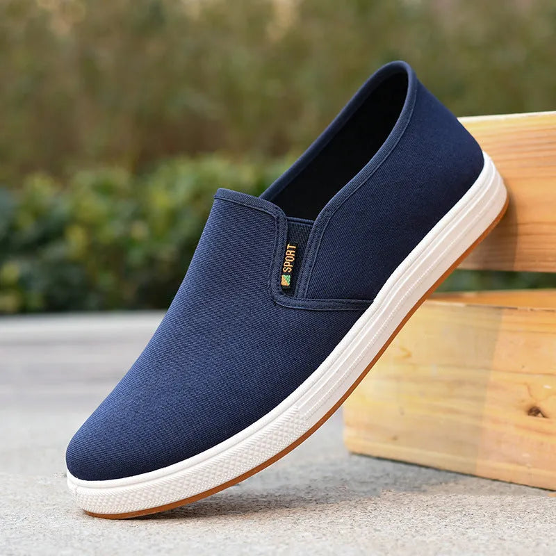 Men's low-top canvas cloth shoes with slip-on design and composite sole in black colour