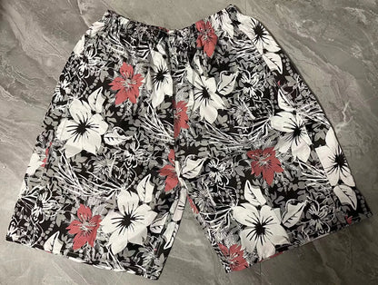 Men's floral patterned swim shorts with five-point cut design