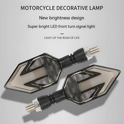 Arrow-shaped LED motorcycle directional turn signal light for 12V systems.