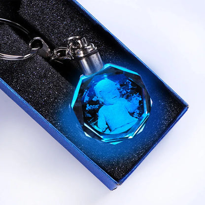 Custom laser-etched crystal photo keychain with internal colourful LED light activated, showing a personalised image.