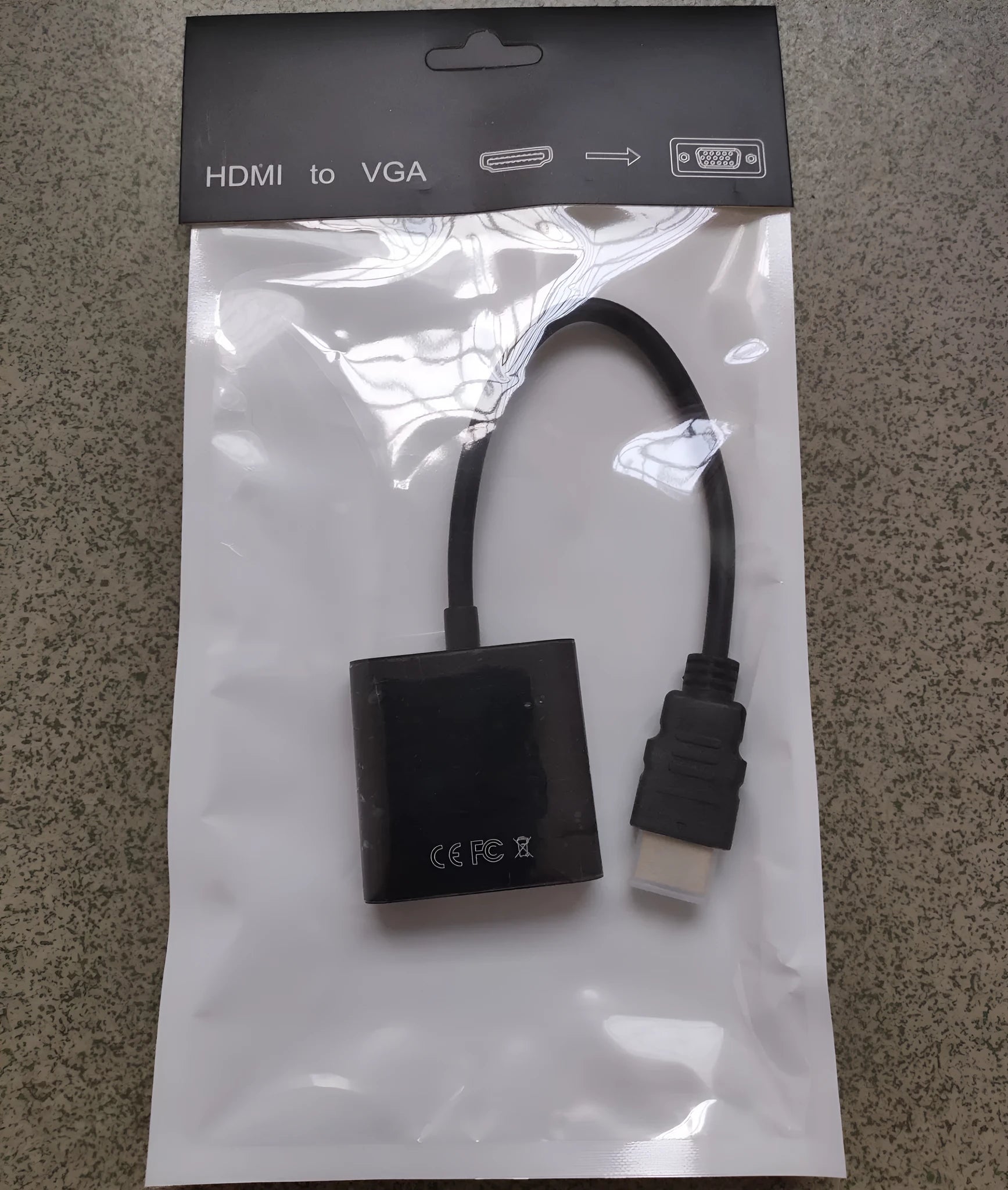 Black HDMI to VGA converter cable showing HDMI male connector and VGA female port