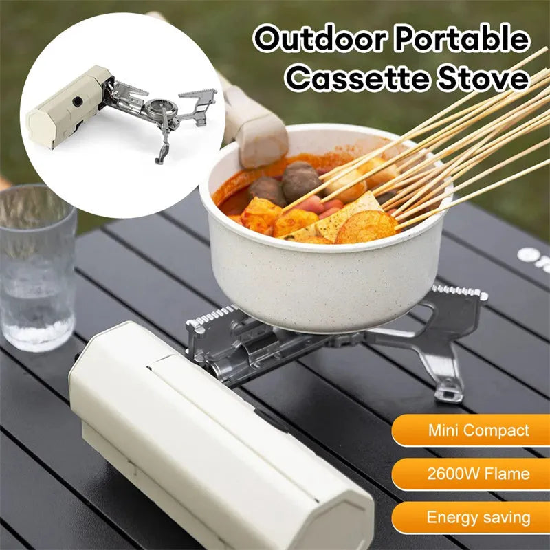 Green folding camping gas stove with serrated pot bracket, showing 25cm size next to butane canister