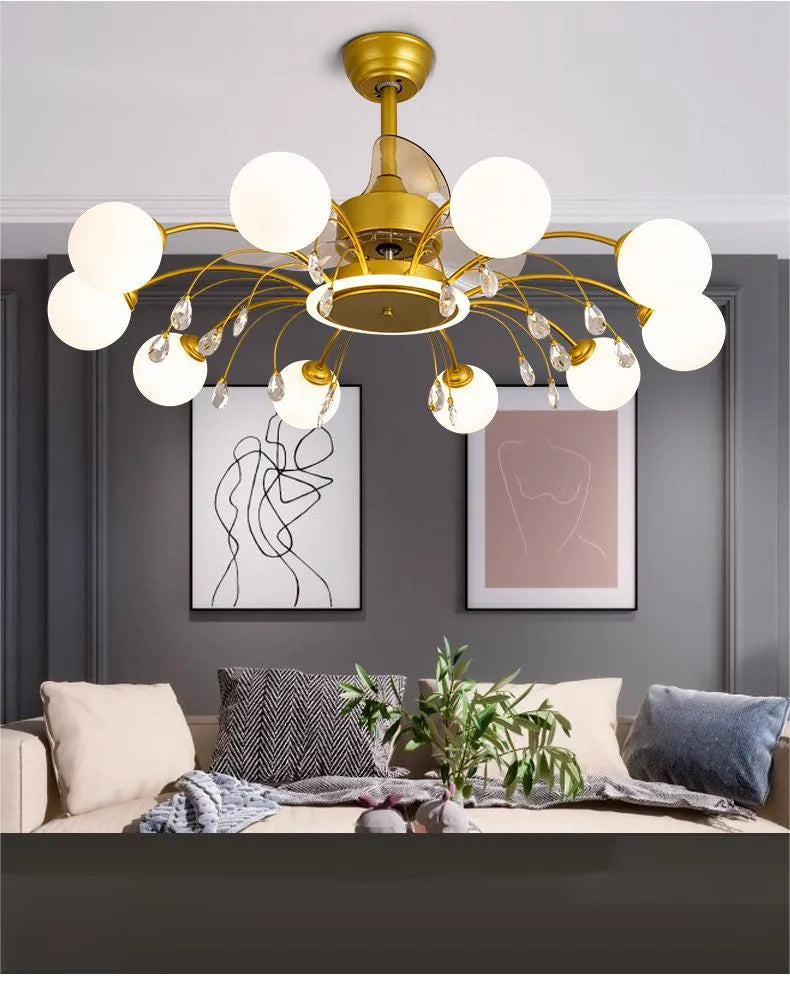 Black and gold ceiling fan lamp with acrylic shade and metal blades, shown with remote control.